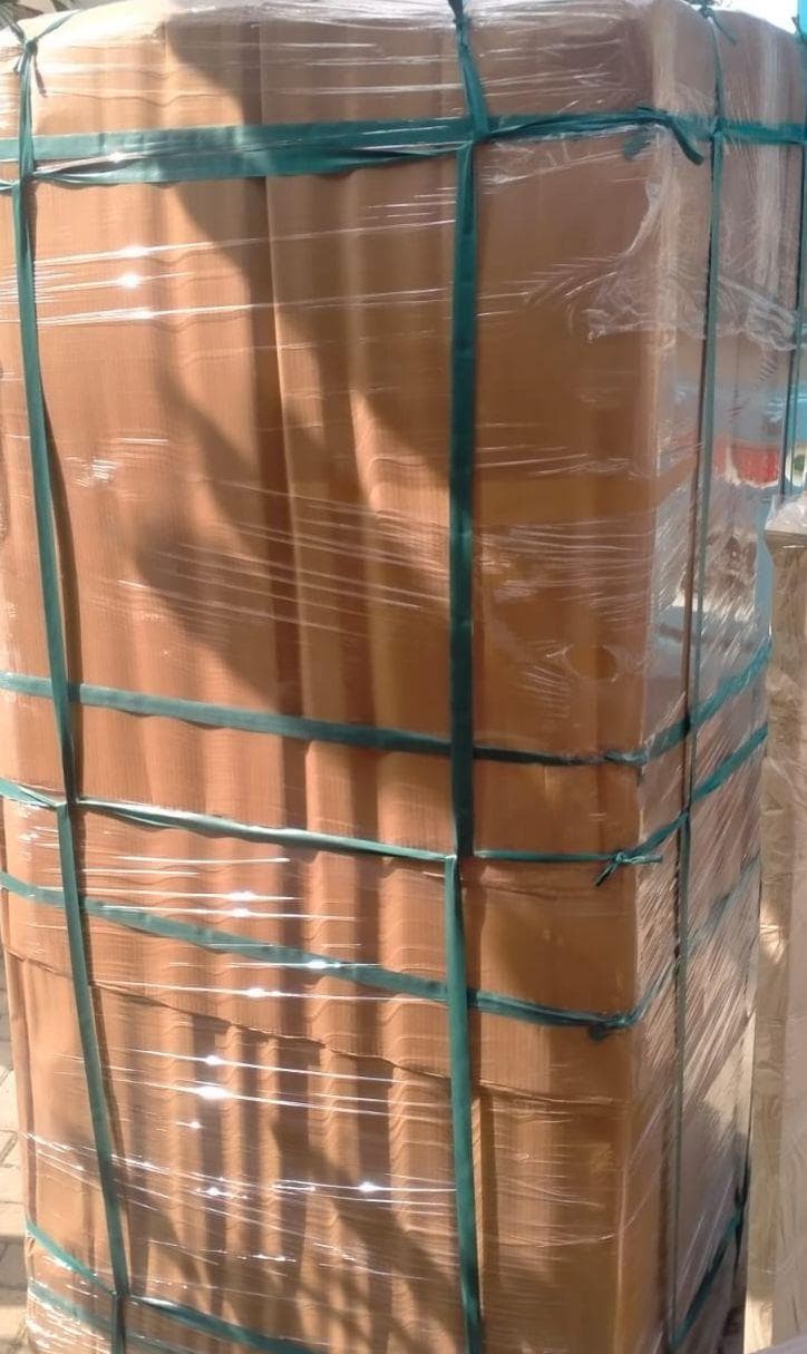 Furniture packing with stretch wrap and straps